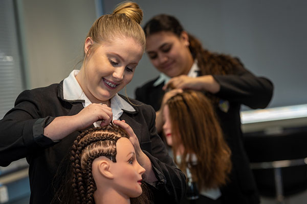 VET hairdressing Hairdressing students practicing their skills at Southern Cross Catholic Vocational College Burwood before COVID-19