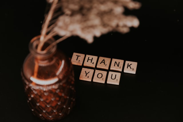 Thank you is spelled out with Scrabble tiles