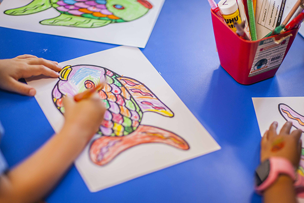 Is your child ready for Kindergarten? A small child works on a fish drawing