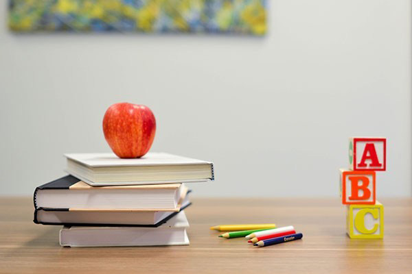 Australian-Primary-Principal’s-Day-St-Therese-Mascot-St-Mary’s-North-Sydney Australian-Primary-Principal's-Day apple on top of books
