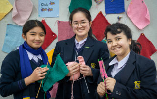 Bethlehem College Ashfield students Chloe Dionisio, Chloe Juwono and Zanthia Trava knitting together