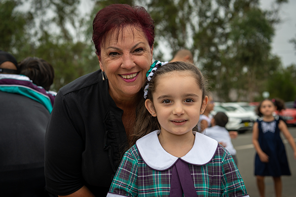 St Anthony of Padua Catholic College Austral principal Lea De Angelis with one of the school's new Kindy students.