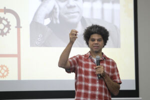 Poet Miles Merrill presents at the ...
</p srcset=