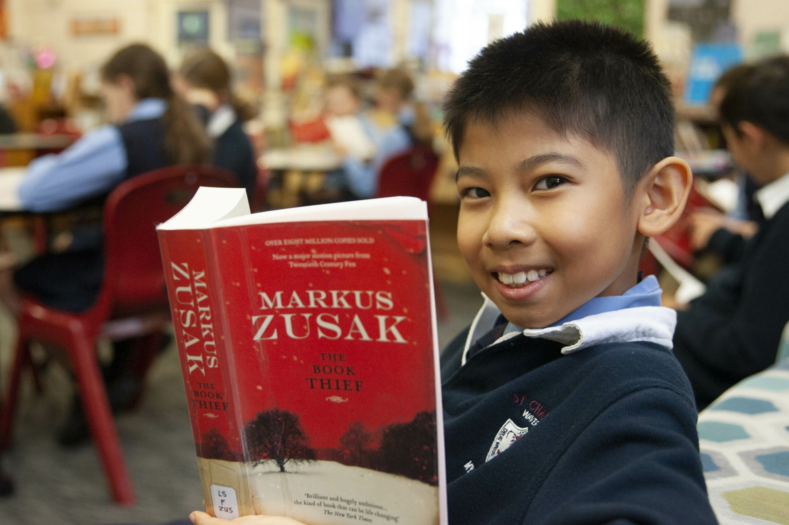 St Charles’ Waverley literature group (2) A boy from St Charles' literature enrichment group reads 'The Book Thief'
