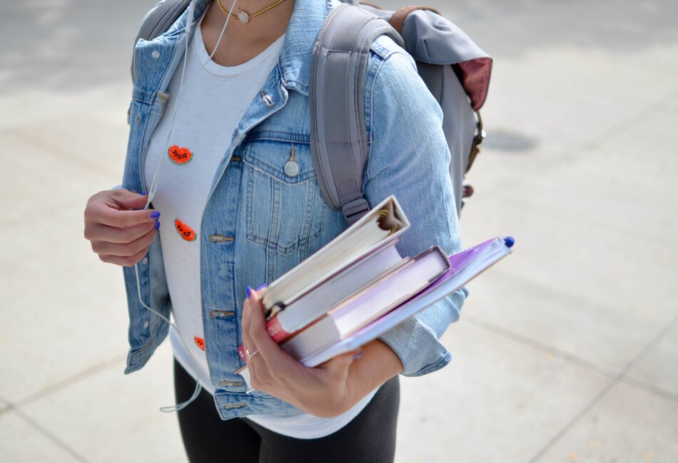 Woman holding text books