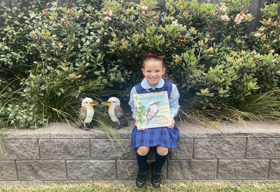 Chiara Castelvetere holds picture book Kookaburra