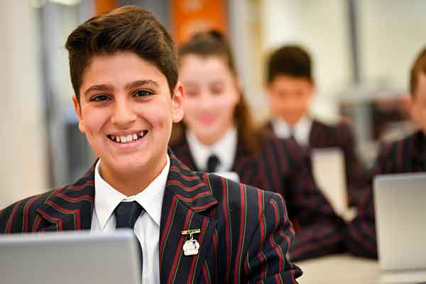 Three-secondary-students-wellbeing-SCS Three-secondary-students-wellbeing on a laptop