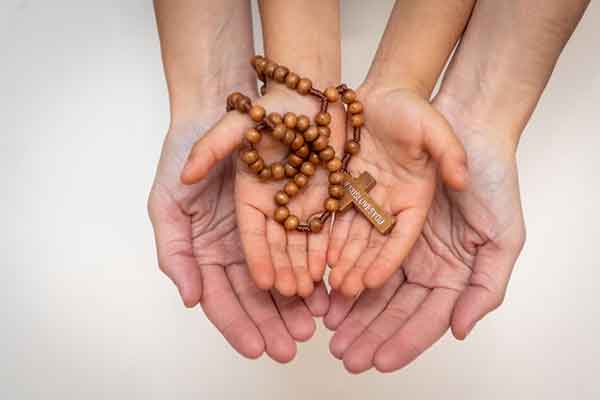 wellbeing-SCS-approach two hands with rosary