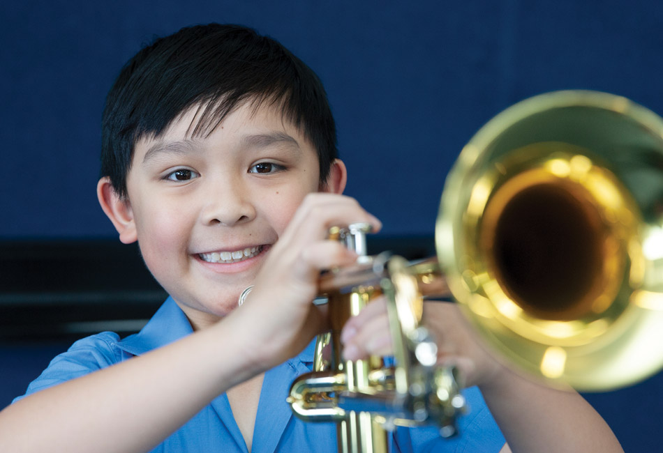 Amadeus Music Education Program student playing an instrument Amadeus Music Education Program student playing an instrument