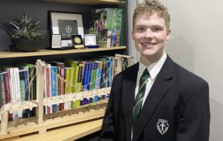 Hayden Westwood with the bridge experiment that won him a 2021 STANSW Young Scientist Award.