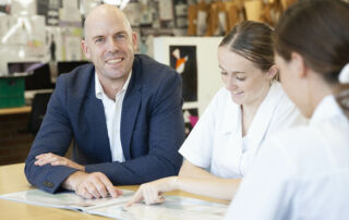 Uprising co-founder Richard Hainsworth works with Brigidine College Randwick's current crop of Design and Technology students. Photo: Natalie Roberts