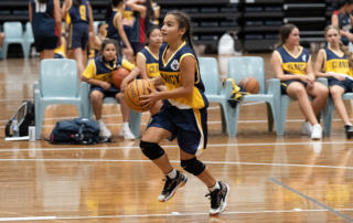 Girl playing Basketball