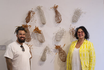 Sydney mural artist Danny Mulyono is pictured with Clancy Religious Art Prize coordinator Ivanka Rancic and winning artwork Twelve Baskets.