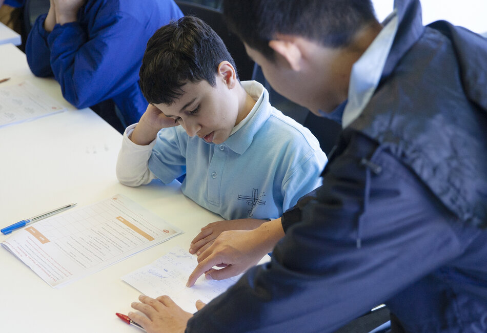 Patrician Brothers Fairfield Maths enrichment program A Patrician Brothers' Fairfield maths student mentor helps a primary student solve a problem