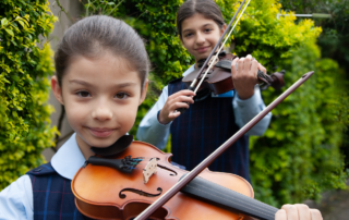 Amadeus Music Education Program students Olivia and Serena from St John Vianney Catholic Primary School Greenacre