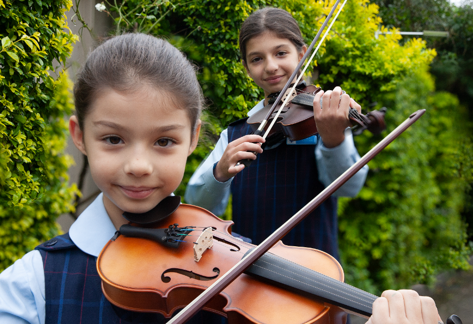 Amadeus Music Education Program students Olivia and Serena from St John Vianney Catholic Primary School Greenacre Amadeus Music Education Program students Olivia and Serena from St John Vianney Catholic Primary School Greenacre
