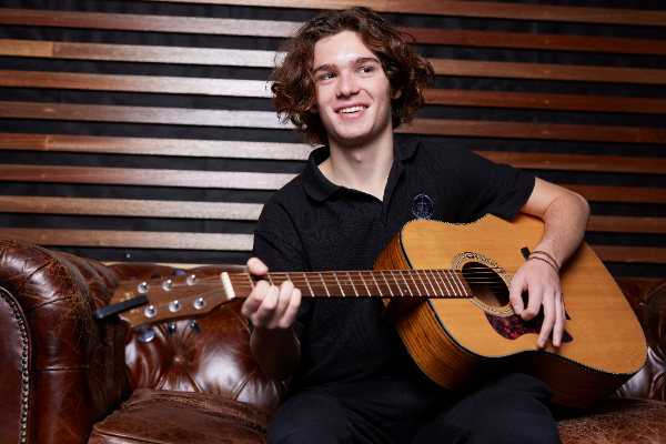 Acting aspirant Sebastian Youseff playing on his guitar