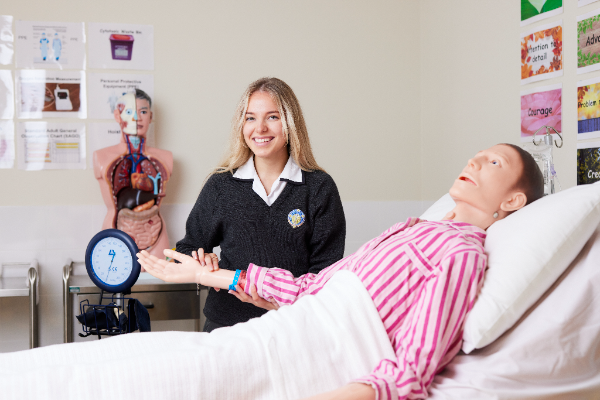 Southern Cross Burwood Southern Cross Burwood Health Services Assistance student Macey Danger treating Frank the dummy