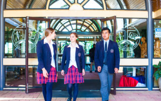 Students from Freeman Catholic College Bonnyrigg Heights outside their school