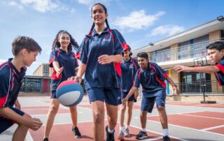 Students play basketball