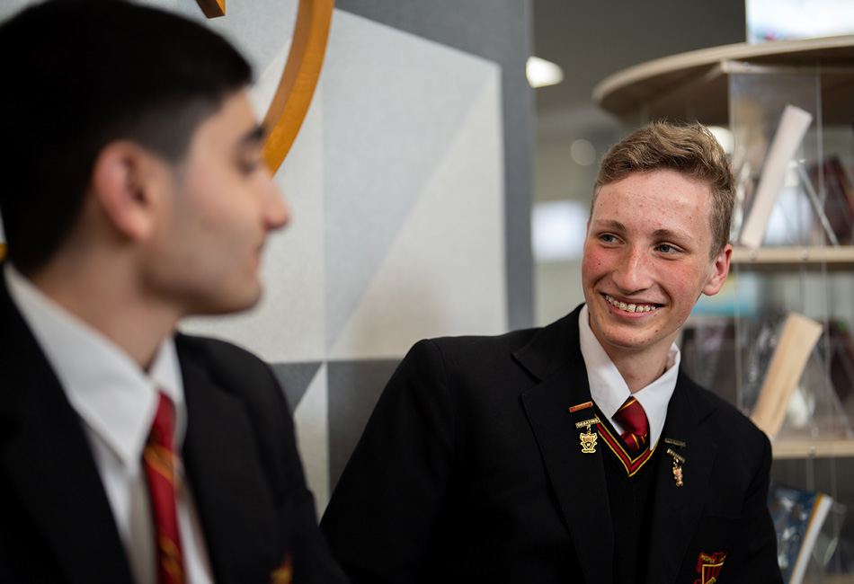 Mental Mates Mental Mates creator Archie Kingham talks with a peer at Marist College Eastwood.