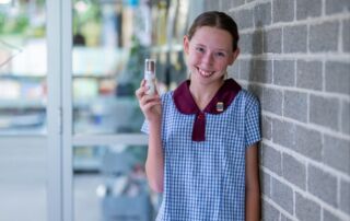 Lilah Brock with her STEM project prototype, the Sun Brush.