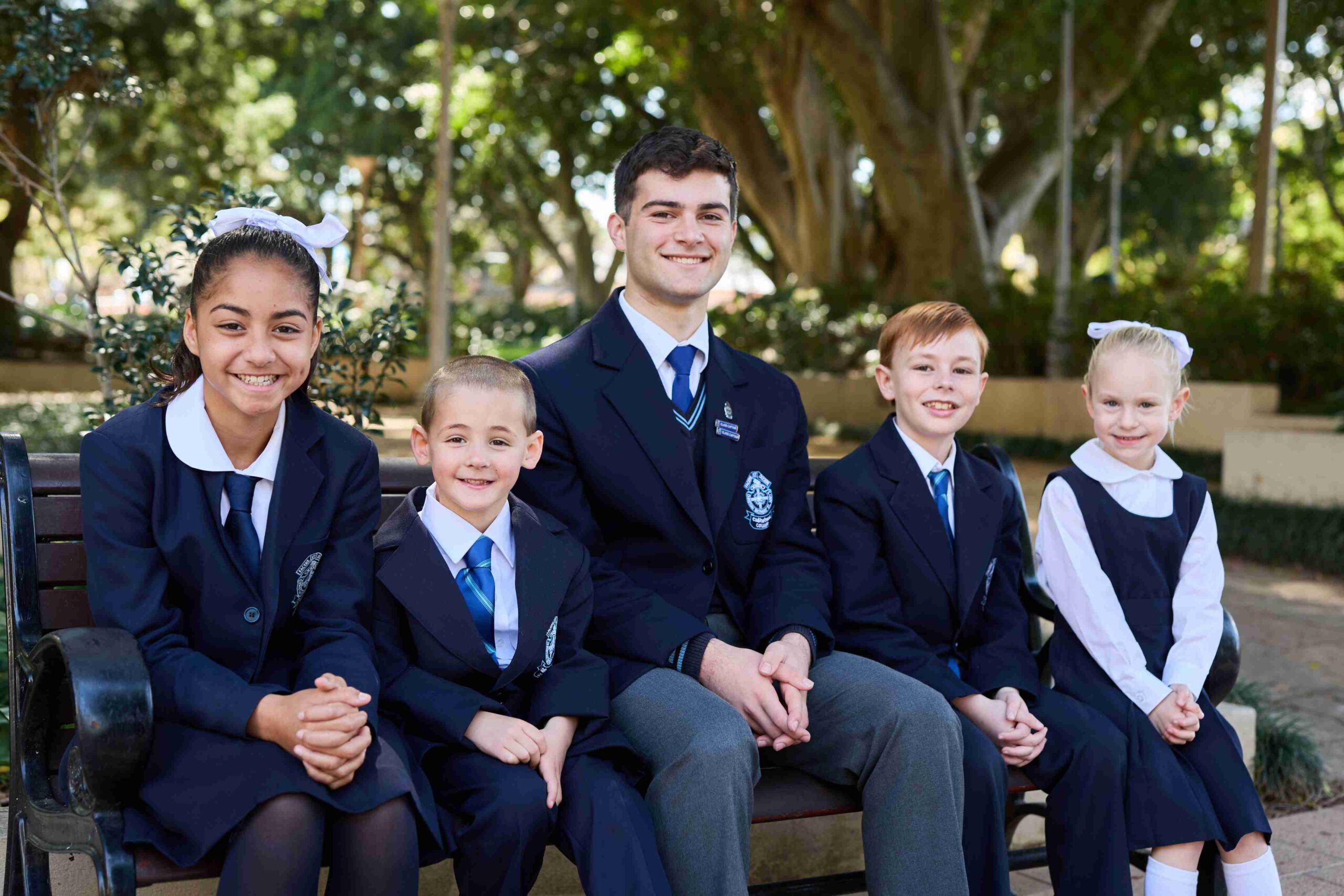 EMBARGOED_2023_SydneySMCC_1182799234_DS_098 (1) Photo of five students, both boys and girls, in their new St Mary's Cathedral College uniforms