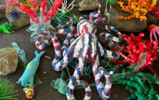 Students' ocean-themed sculpture displayed on the playground