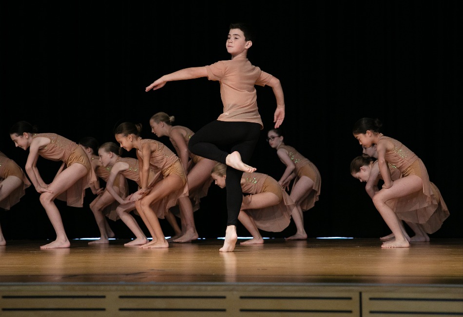 Eisteddfod Dance A group of primary school students dance on stage at a Sydney Catholic Schools Eisteddfod event.