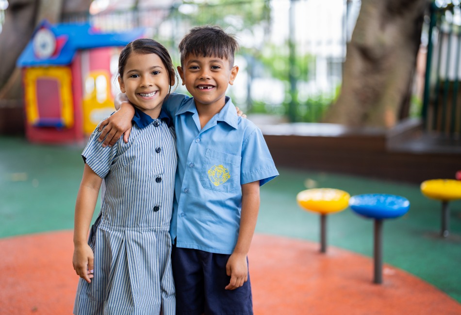 Friendships and a growth mindset help to grow students’ resilience. Two primary school friends in a school playground. Friendships and a growth mindset help to grow students' resilience.