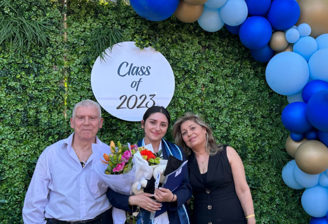 Resized Images For SCS Websites (36) (1) A photo of Nancy and her family at her Year 12 graduation ceremony