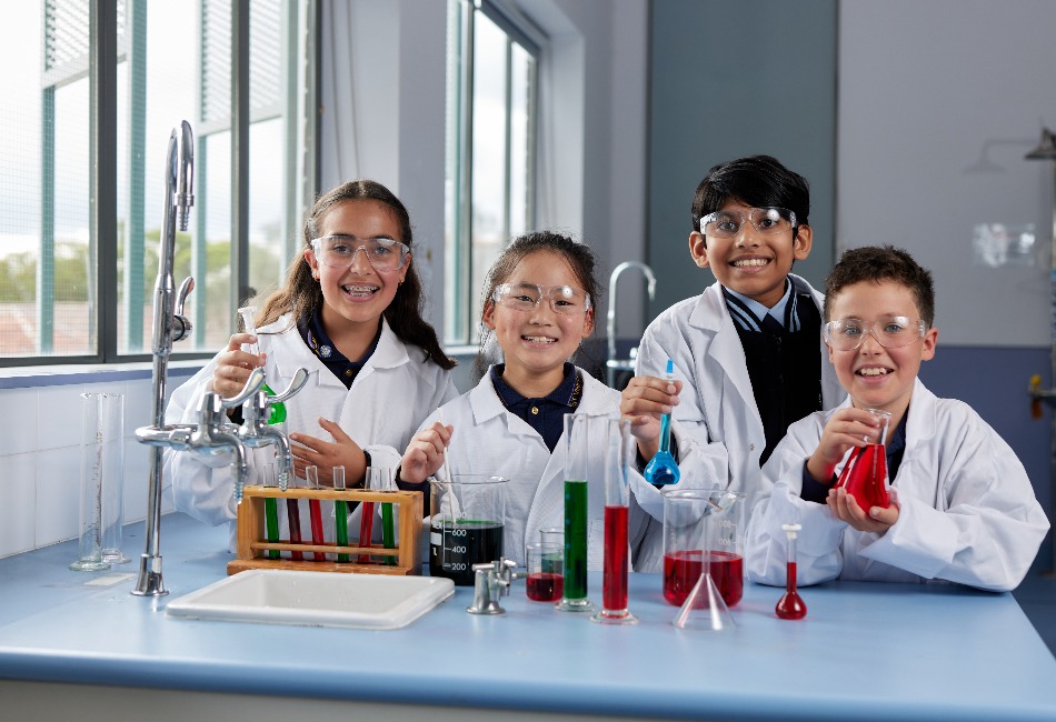 STEM learning Students complete experiement in Science lab.