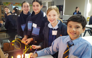 Students experiment with light in a Science lab.