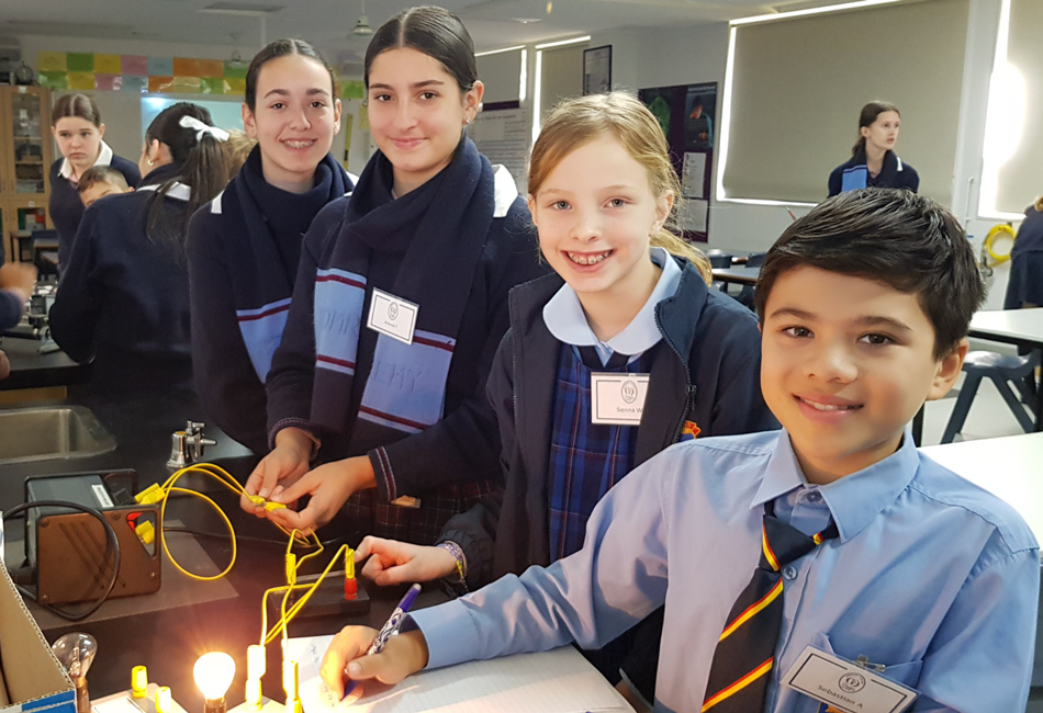Students experiment with light in a Science lab.