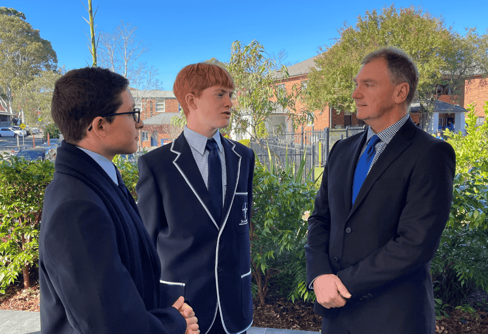Principal Peter Buxton speaking with to two students An image of Principal Peter Buxton speaking with two male students at De La Salle Catholic College Caringbah