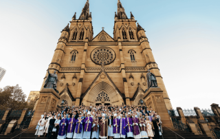 Photo showing beginning teachers, school leaders, and our new Executive Director, Danielle Cronin on the steps of St Mary's Cathedral