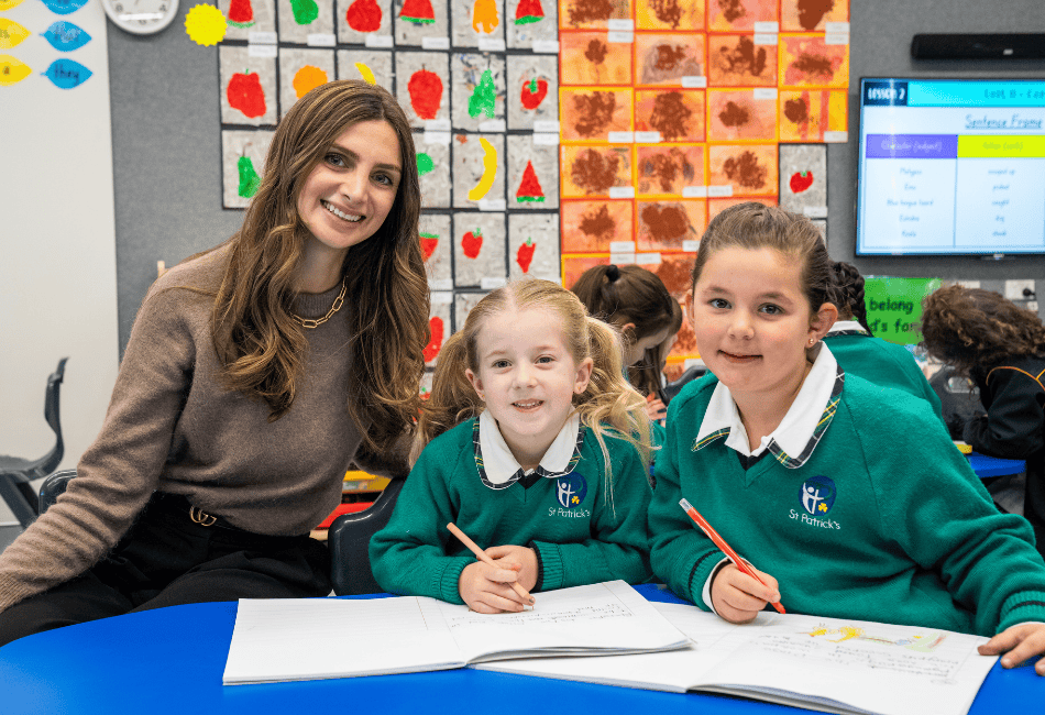 A photo showing a teacher and scholarship recipient with two female students A photo showing a teacher and scholarship recipient with two female students