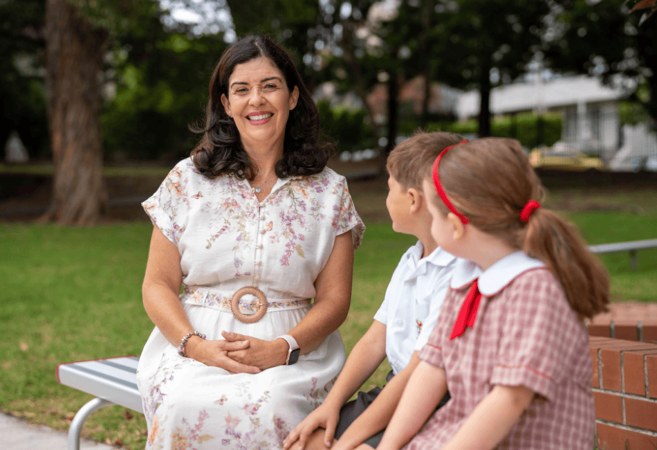 Principal Kylie Brakel with two female students A photo showing Principal Kylie Brakel with two female students