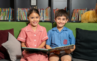 A photo of two students from St Therese Catholic Primary School Miller reading