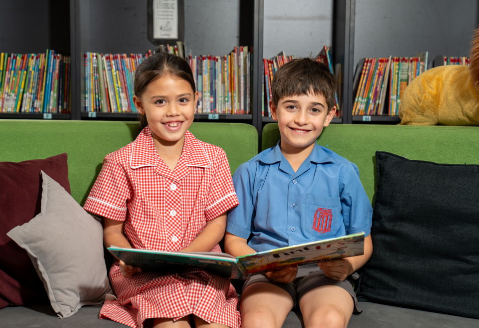 Students from St Therese Catholic Primary School Miller reading A photo of two students from St Therese Catholic Primary School Miller reading