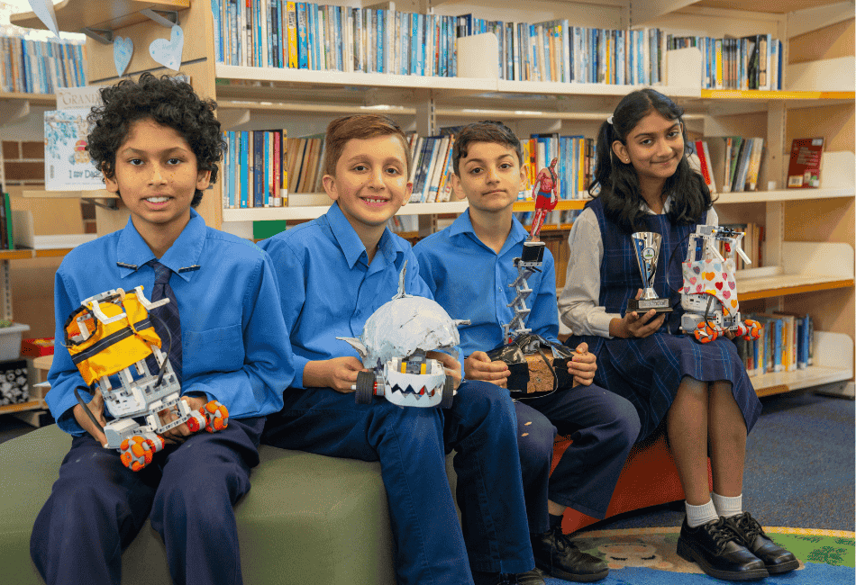 Four students from St Anne’s Catholic Primary School Strathfield South showcasing their innovative robotic creations A photo of four students from St Anne’s Catholic Primary School Strathfield South showcasing their innovative robotic creations