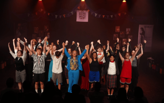 A photo showing the entire cast of The Shakespeare Project taking a bow at the conclusion of a performance