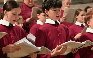 A photo of students from the St Mary’s Cathedral Choir singing