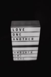 The words 'Love one another.'