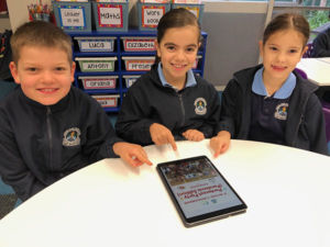 St Michael's Catholic Primary School Meadowbank Year 2 pupils Rafe, Gemma and Elena with the school's 2020 cookbook