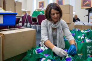 Sydney Catholic Schools Leader of Learning Early Learning, Sheree Rose helps pack education packs for refugee students.