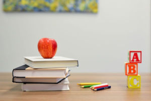 Australian-Primary-Principal's-Day apple on top of books