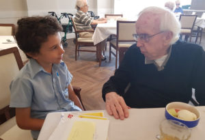Pen pals Father Bernie and St Charles Catholic Primary School Ryde student Francis.