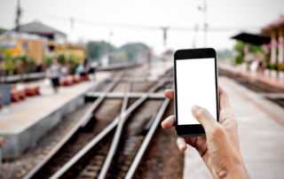 Commuter uses app at train station