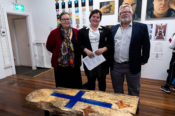 Southern Cross College Burwood student Charlotte McCaughan with her Clancy Prize artwork and parents